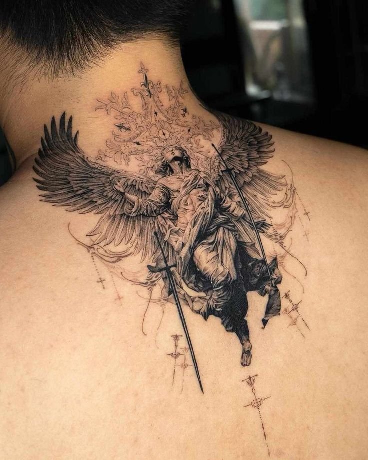 black and grey angel holding a sword tattoo on upper back with wings spread
